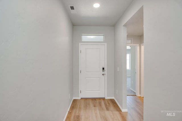 doorway to outside featuring light wood-type flooring