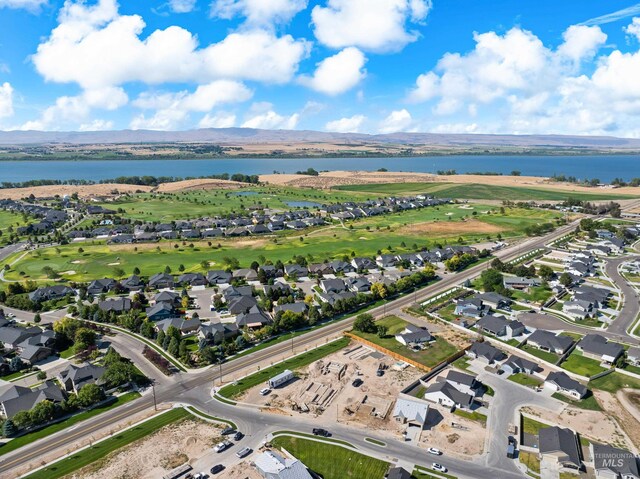 birds eye view of property featuring a mountain view