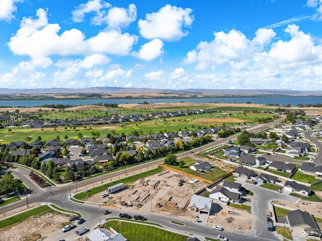 birds eye view of property featuring a mountain view