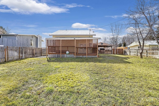 view of yard featuring a gazebo and a fenced backyard