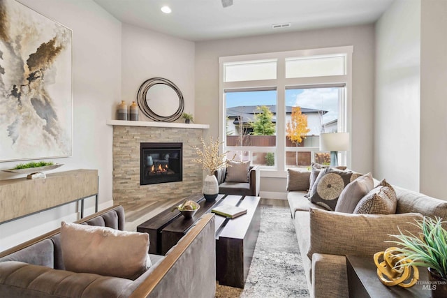 living room with a fireplace and hardwood / wood-style flooring