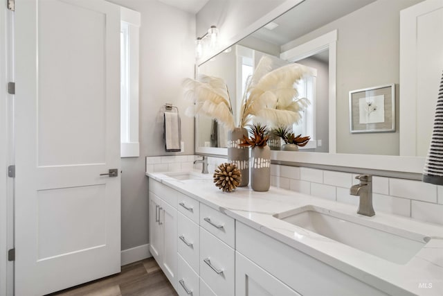 bathroom with hardwood / wood-style flooring and vanity