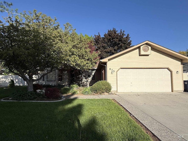 625 Trotter Dr, Twin Falls, ID 83301 - view of front of house with an attached garage, a front yard, and driveway