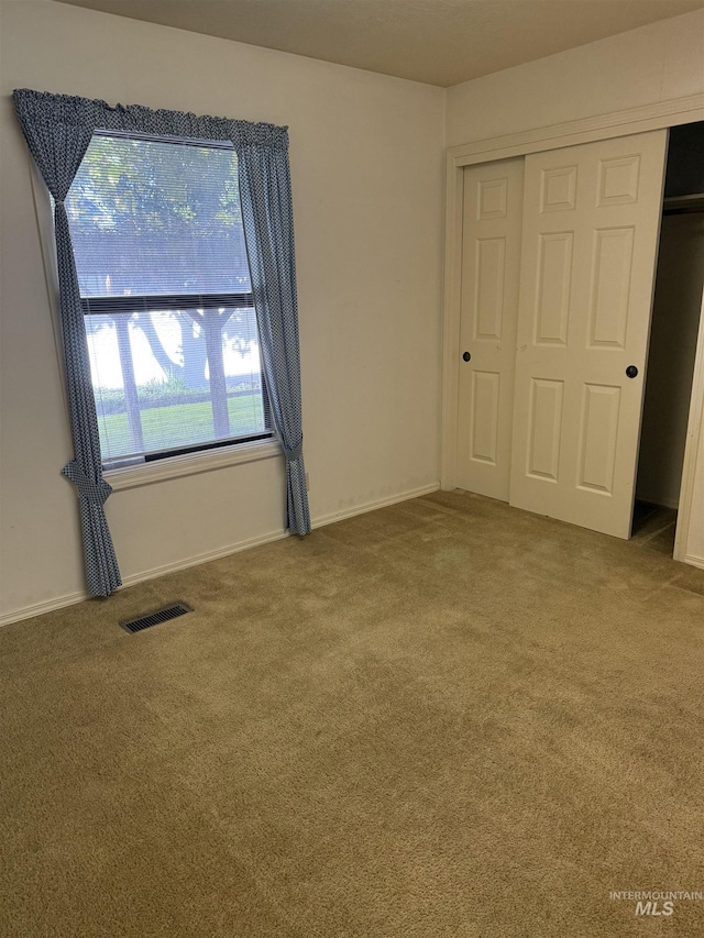 625 Trotter Dr, Twin Falls, ID 83301 - unfurnished bedroom featuring carpet flooring, a closet, and baseboards