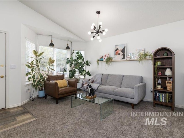 5287 Stuart Ave, Chubbuck, ID 83202 - living room featuring vaulted ceiling, a chandelier, carpet flooring, and baseboards