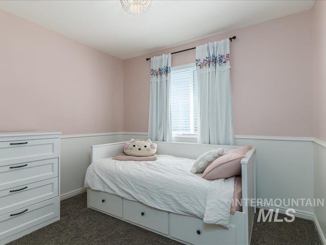 5287 Stuart Ave, Chubbuck, ID 83202 - bedroom featuring dark colored carpet and baseboards