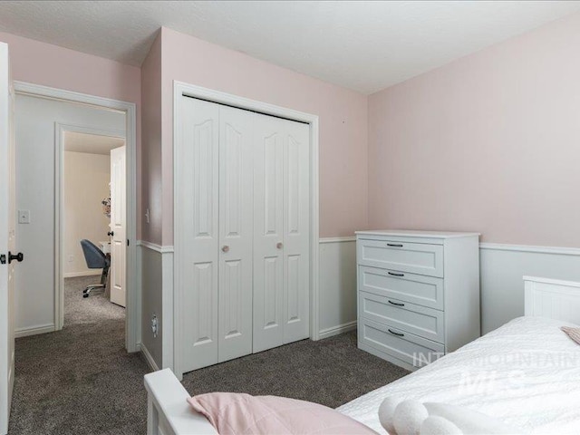 5287 Stuart Ave, Chubbuck, ID 83202 - bedroom featuring dark colored carpet, a closet, and baseboards