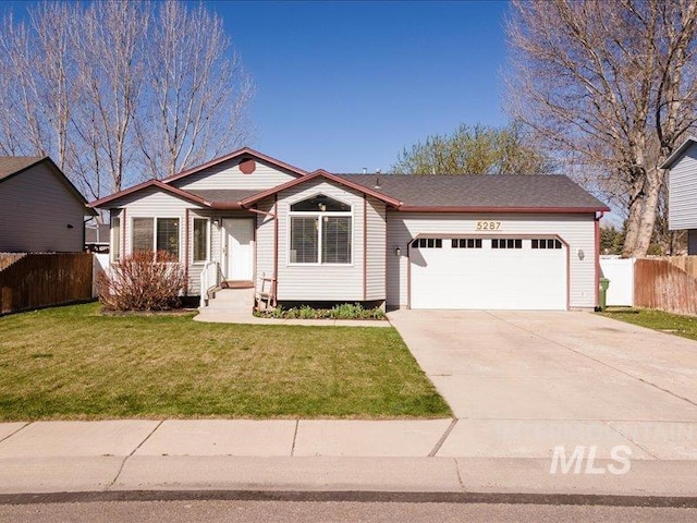 5287 Stuart Ave, Chubbuck, ID 83202 - view of front of house featuring a garage and driveway