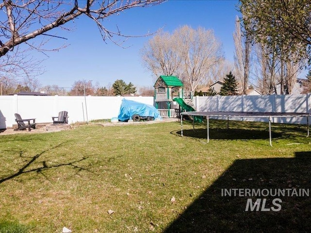 5287 Stuart Ave, Chubbuck, ID 83202 - view of yard with a playground and a trampoline
