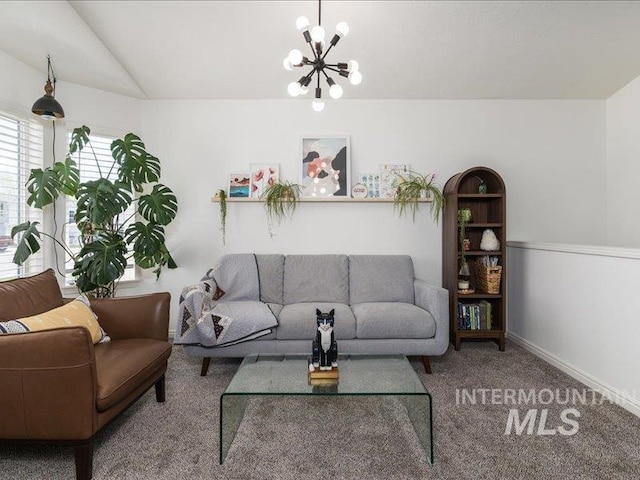 5287 Stuart Ave, Chubbuck, ID 83202 - carpeted living area with a chandelier, baseboards, and vaulted ceiling