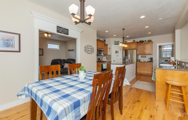 818 W Dallan Woods Way, Nampa, ID 83686 - dining room featuring light wood-type flooring, recessed lighting, and a chandelier