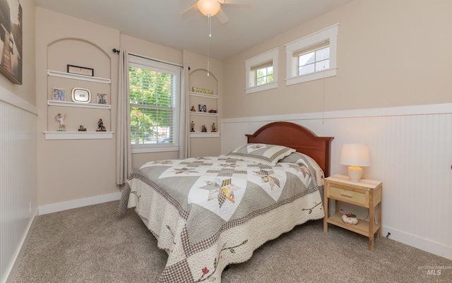 818 W Dallan Woods Way, Nampa, ID 83686 - bedroom with carpet floors, wainscoting, and a ceiling fan