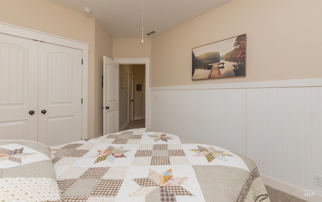 818 W Dallan Woods Way, Nampa, ID 83686 - carpeted bedroom with a closet, wainscoting, and attic access