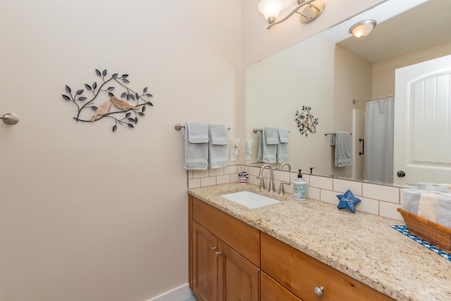818 W Dallan Woods Way, Nampa, ID 83686 - bathroom with vanity and decorative backsplash