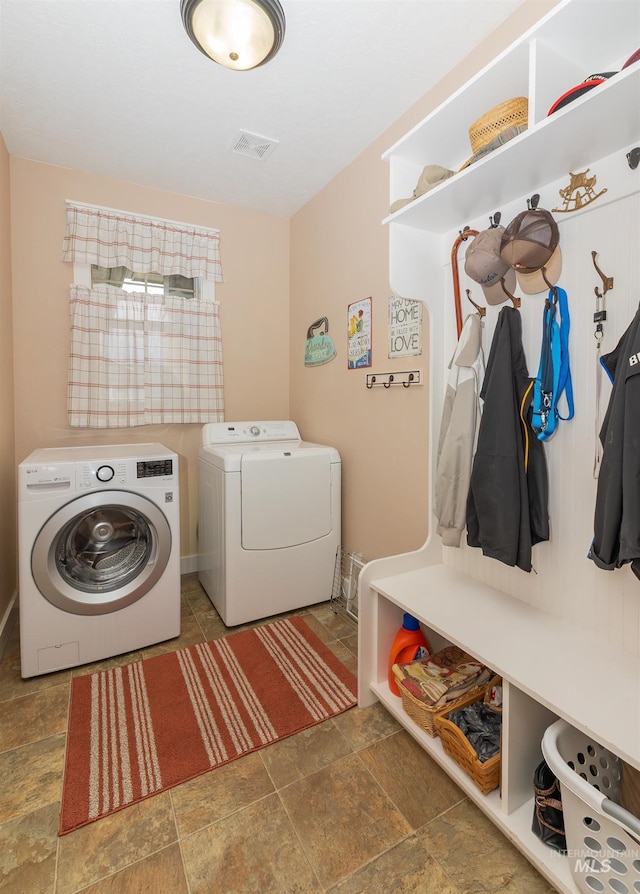 818 W Dallan Woods Way, Nampa, ID 83686 - washroom featuring washer and dryer and stone finish floors