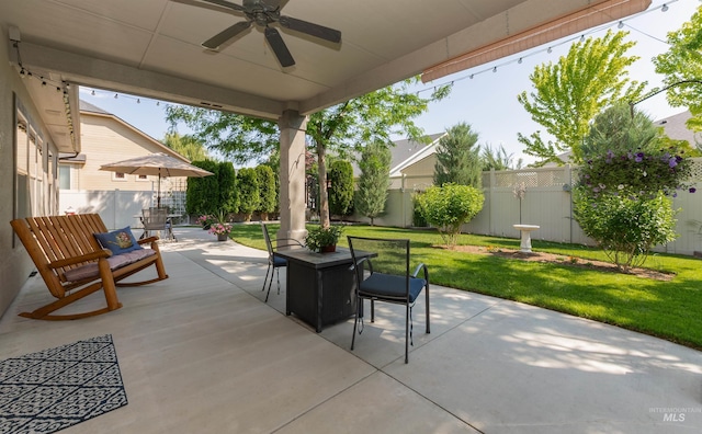 818 W Dallan Woods Way, Nampa, ID 83686 - fenced backyard featuring outdoor dining area, ceiling fan, and a patio area