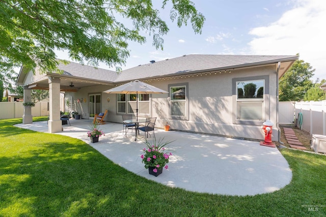 818 W Dallan Woods Way, Nampa, ID 83686 - rear view of property with a ceiling fan, a patio, stucco siding, and a fenced backyard
