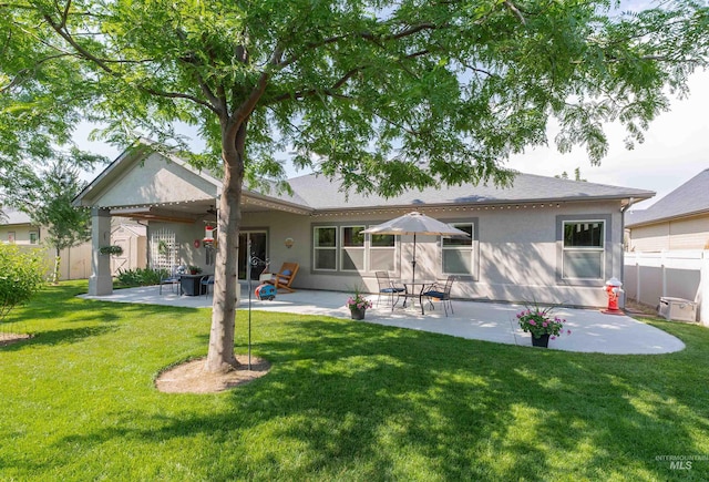 818 W Dallan Woods Way, Nampa, ID 83686 - back of house featuring stucco siding, a patio, and ceiling fan