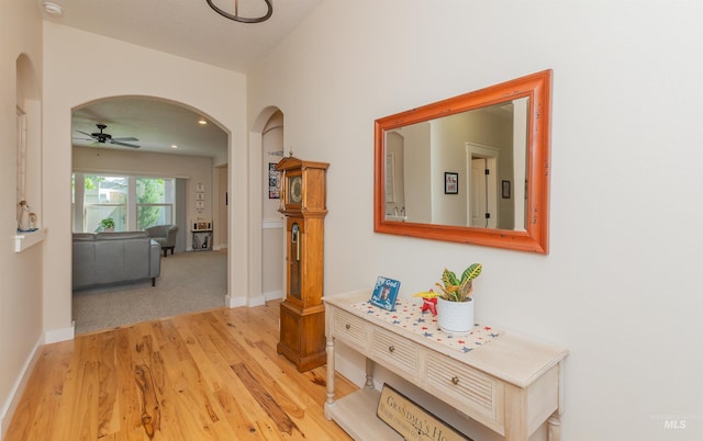 818 W Dallan Woods Way, Nampa, ID 83686 - corridor featuring arched walkways and light wood finished floors