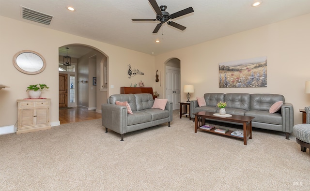 818 W Dallan Woods Way, Nampa, ID 83686 - carpeted living room with arched walkways, a ceiling fan, and recessed lighting