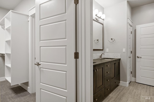 bathroom featuring vanity and wood-type flooring