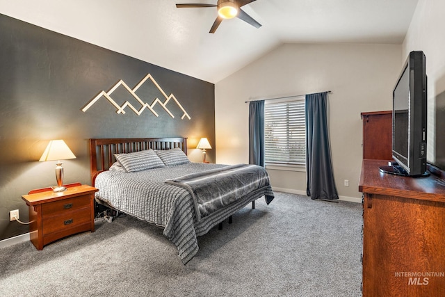 carpeted bedroom with ceiling fan and vaulted ceiling