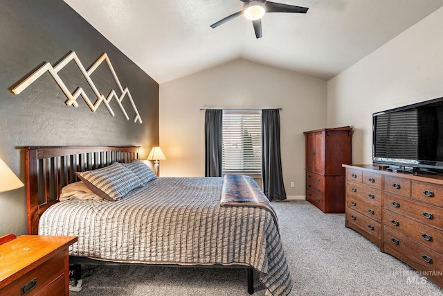 carpeted bedroom with ceiling fan and vaulted ceiling