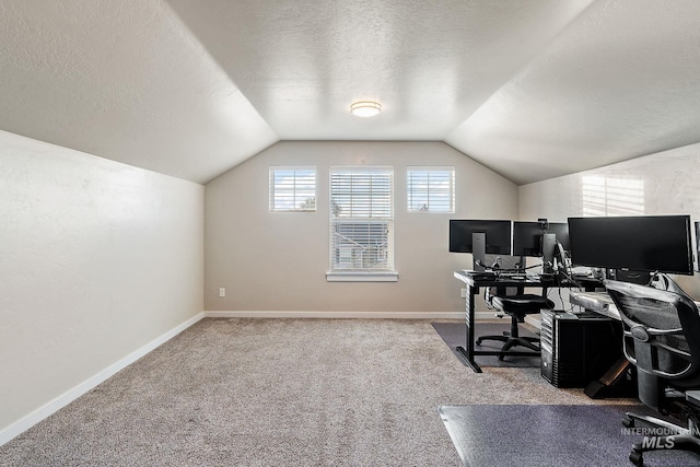 office with carpet flooring, a textured ceiling, and vaulted ceiling