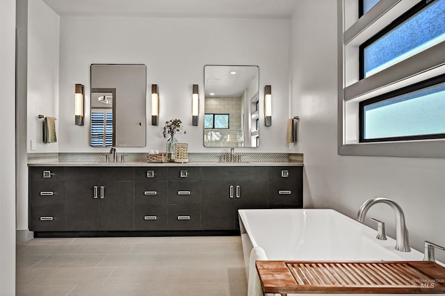 1771 S Riparian Way, Eagle, ID 83616 - bathroom with a freestanding bath, double vanity, and tile patterned floors