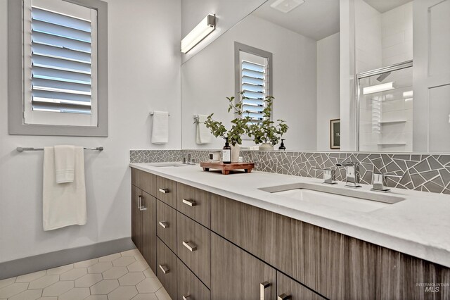 1771 S Riparian Way, Eagle, ID 83616 - bathroom featuring tasteful backsplash, tile patterned flooring, double vanity, and an enclosed shower