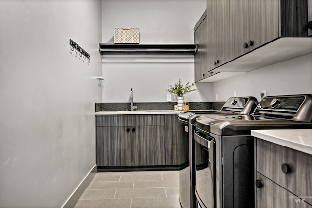 1771 S Riparian Way, Eagle, ID 83616 - washroom with cabinet space, washer and clothes dryer, baseboards, and tile patterned flooring