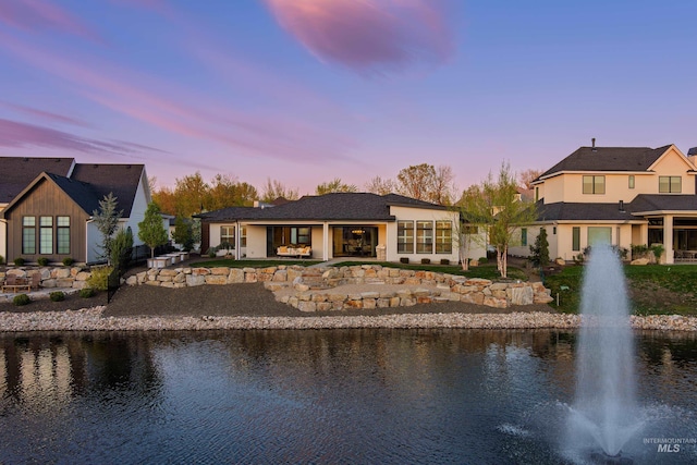 1771 S Riparian Way, Eagle, ID 83616 - back of house with a water view and a patio area