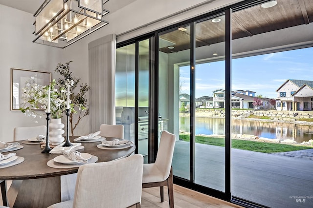 1771 S Riparian Way, Eagle, ID 83616 - dining area with a water view, a residential view, and a chandelier