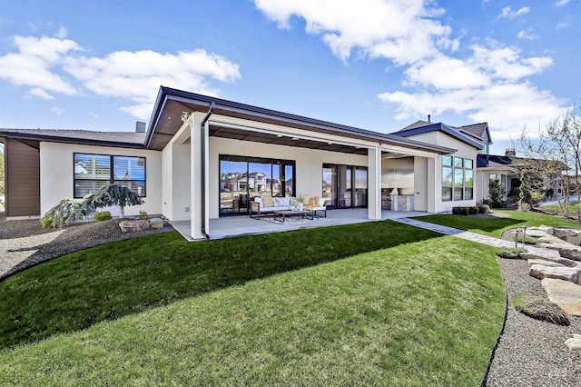 1771 S Riparian Way, Eagle, ID 83616 - back of house with stucco siding, a patio area, and a lawn