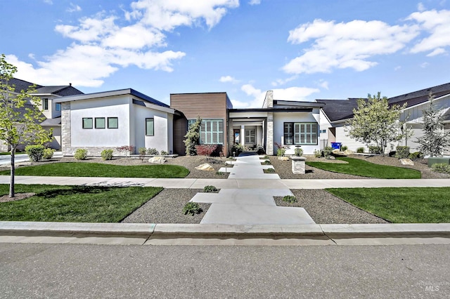 1771 S Riparian Way, Eagle, ID 83616 - modern home featuring stucco siding and a front yard