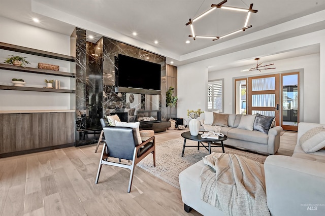 1771 S Riparian Way, Eagle, ID 83616 - living area featuring light wood finished floors, plenty of natural light, recessed lighting, and a high end fireplace
