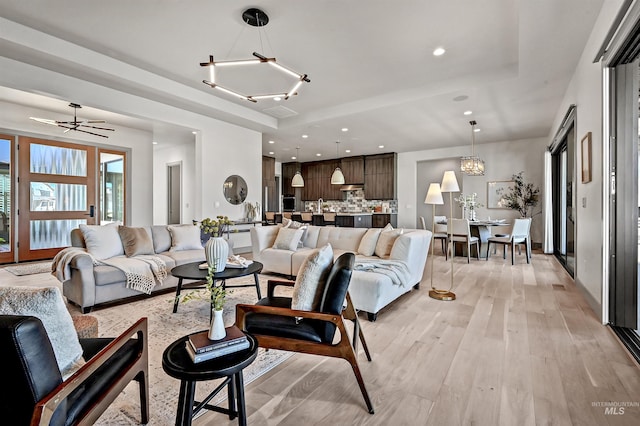 1771 S Riparian Way, Eagle, ID 83616 - living area featuring light wood-style flooring, a chandelier, and recessed lighting