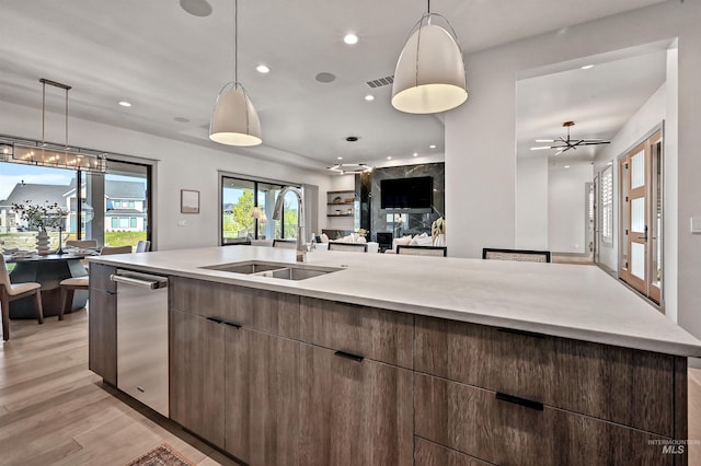 1771 S Riparian Way, Eagle, ID 83616 - kitchen with a sink, open floor plan, recessed lighting, light wood-style flooring, and modern cabinets