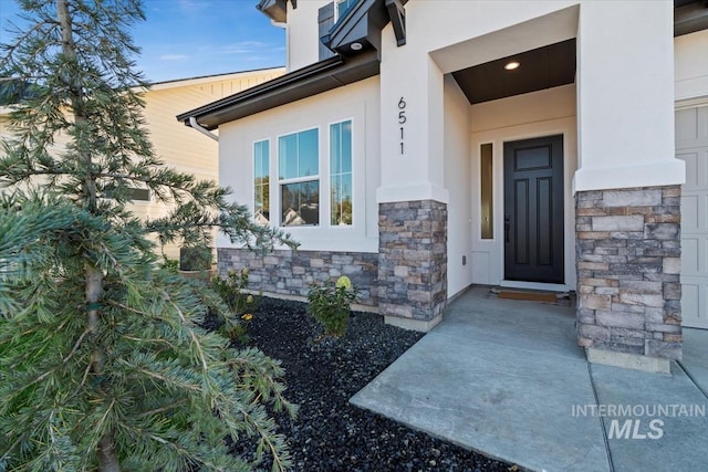 6511 W Donatella St, Eagle, ID 83616 - view of exterior entry featuring stucco siding and stone siding