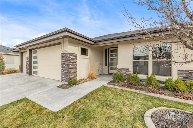view of front of property featuring stucco siding, stone siding, a garage, and a front lawn