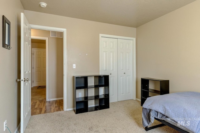1587 N Firebrick Dr, Kuna, ID 83634 - bedroom with a closet, visible vents, baseboards, and carpet flooring