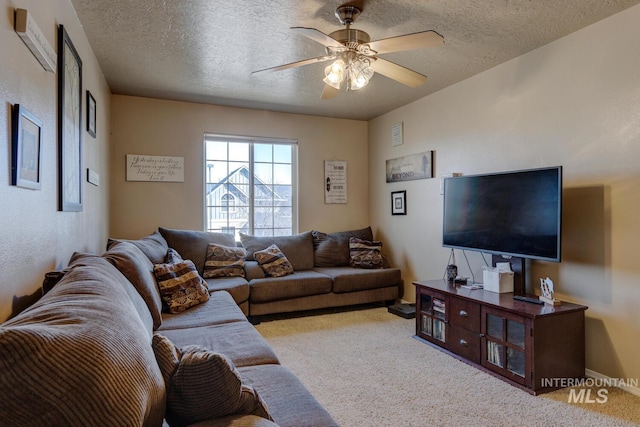 1587 N Firebrick Dr, Kuna, ID 83634 - living room featuring carpet floors, ceiling fan, a textured ceiling, and baseboards