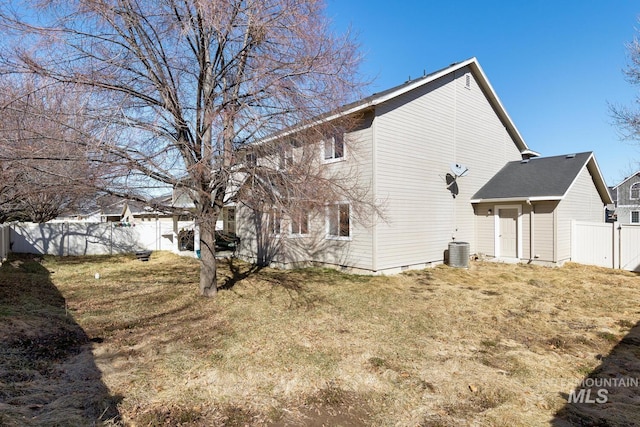 1587 N Firebrick Dr, Kuna, ID 83634 - view of side of home with a fenced backyard, a lawn, and central AC unit