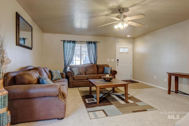 1587 N Firebrick Dr, Kuna, ID 83634 - living room featuring a ceiling fan, carpet, a textured ceiling, and baseboards