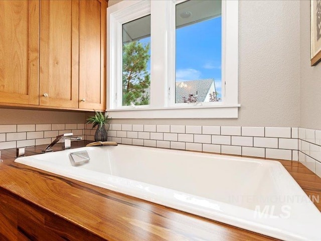 bathroom with a washtub