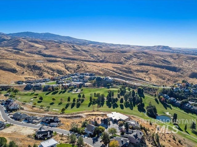 birds eye view of property with a mountain view and a residential view