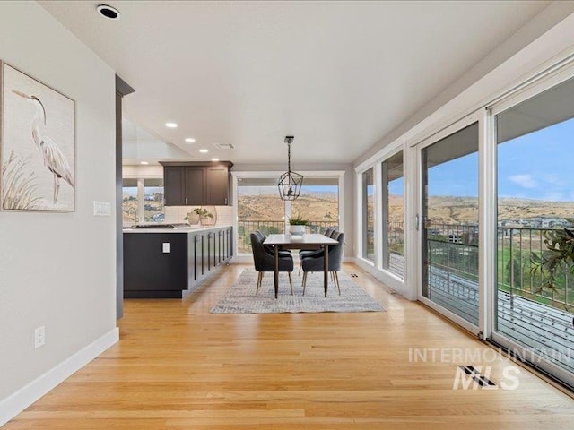 dining room featuring recessed lighting, light wood-style flooring, visible vents, and baseboards