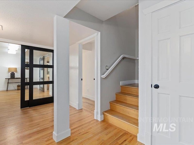 stairs with wood-type flooring