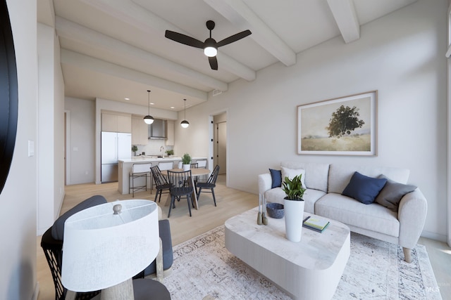 living room featuring sink, ceiling fan, beamed ceiling, and light hardwood / wood-style flooring