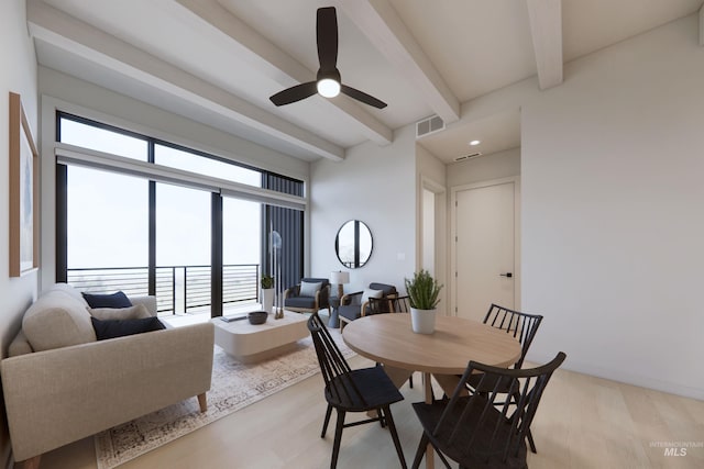 dining room featuring ceiling fan, beamed ceiling, and light hardwood / wood-style flooring